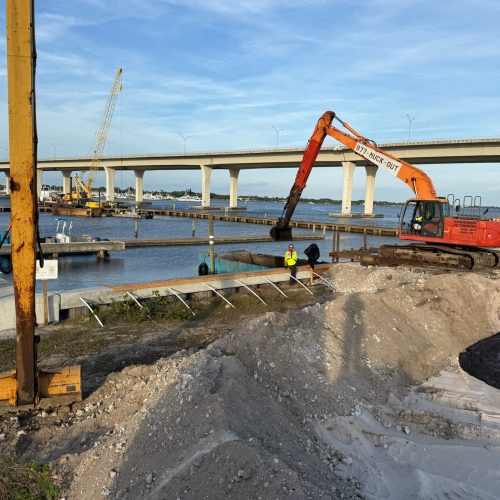 A serene coastal landscape with calm waters and a distant horizon under a clear blue sky, captured in IMG_1105.